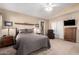 Comfortable bedroom features soft carpeting, neutral paint, and ample closet space at 3408 W Taro Ln, Phoenix, AZ 85027