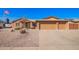 Charming brick home featuring a three-car garage, low maintenance front yard and an American flag in the front at 3408 W Taro Ln, Phoenix, AZ 85027