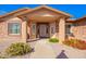 Inviting front porch with decorative door, manicured plants, and well-maintained landscaping at 3408 W Taro Ln, Phoenix, AZ 85027