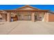 Spacious three-car garage with an epoxy floor, workstation, and ample storage at 3408 W Taro Ln, Phoenix, AZ 85027