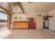 Clean garage featuring an epoxy floor, pegboard, tool chest, and storage cabinets at 3408 W Taro Ln, Phoenix, AZ 85027