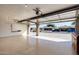 Open garage with epoxy floor and exterior view to the neighborhood at 3408 W Taro Ln, Phoenix, AZ 85027