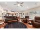 Spacious living room with wood floors, ceiling fan and views into the kitchen at 3408 W Taro Ln, Phoenix, AZ 85027