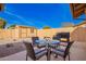 Outdoor patio featuring a glass table with chairs, a barbecue grill, and a storage shed at 3408 W Taro Ln, Phoenix, AZ 85027