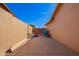 A wide concrete side yard in between two houses and a stucco wall at 3408 W Taro Ln, Phoenix, AZ 85027