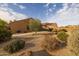 Beautiful backyard featuring desert landscaping, a covered patio, and inviting outdoor space at 3896 E Aragonite Ln, San Tan Valley, AZ 85143