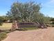 The Village at Copper Basin entrance sign featuring attractive stone accents and desert plants at 3896 E Aragonite Ln, San Tan Valley, AZ 85143