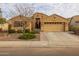 Charming single-story home with desert landscaping, a two-car garage and a covered front porch at 3896 E Aragonite Ln, San Tan Valley, AZ 85143