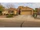 Charming home with desert landscaping, an American flag, and a two-car garage at 3896 E Aragonite Ln, San Tan Valley, AZ 85143