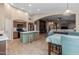 Spacious open-concept kitchen featuring a center island, modern appliances, and seamless flow into the living area at 3896 E Aragonite Ln, San Tan Valley, AZ 85143