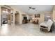 An open and airy living space featuring archways and wood look flooring at 3896 E Aragonite Ln, San Tan Valley, AZ 85143