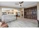 An open living room with views into the kitchen, with wood look tile flooring at 3896 E Aragonite Ln, San Tan Valley, AZ 85143