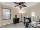 Office space with wood look flooring, fan and a view to the outside at 3896 E Aragonite Ln, San Tan Valley, AZ 85143