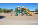 Colorful community playground with swings, climbing wall, slides and crawl spaces at 3896 E Aragonite Ln, San Tan Valley, AZ 85143