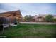 Serene backyard with a stone waterfall, decorative landscaping, and a patio at 4032 E Jojoba Rd, Phoenix, AZ 85044