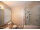 Contemporary bathroom with a glass-enclosed shower and vanity with granite countertop at 4032 E Jojoba Rd, Phoenix, AZ 85044