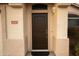 Stylish front door with a modern lock, a welcome mat, and a well-maintained exterior, creating curb appeal at 4032 E Jojoba Rd, Phoenix, AZ 85044