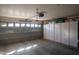 Spacious garage with storage cabinets and an automatic door at 4032 E Jojoba Rd, Phoenix, AZ 85044