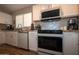 Functional kitchen with white cabinets, stainless steel appliances, and granite countertops at 4032 E Jojoba Rd, Phoenix, AZ 85044