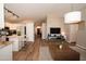 Open-concept living space connecting to kitchen and entryway, offering a modern and inviting atmosphere at 4032 E Jojoba Rd, Phoenix, AZ 85044