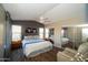 Comfortable main bedroom with a vaulted ceiling, mirrored closet doors, and neutral decor at 4032 E Jojoba Rd, Phoenix, AZ 85044