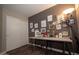 Bright studio with a large desk, stylish lighting and a decorative art gallery wall at 4032 E Jojoba Rd, Phoenix, AZ 85044