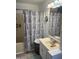 Bathroom with a vanity, patterned shower curtain, and neutral-colored walls at 4065 E University Dr # 556, Mesa, AZ 85205