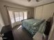 Bedroom featuring a dark hardwood floor, ceiling fan, and sliding door closet at 4065 E University Dr # 556, Mesa, AZ 85205