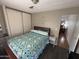 Comfortable main bedroom with a sliding door closet and dark hardwood floors at 4065 E University Dr # 556, Mesa, AZ 85205