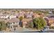 Aerial view of a home with a driveway, landscaping, and proximity to other houses in the community at 43524 W Bailey Dr, Maricopa, AZ 85138