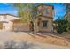 Charming two-story home with a two-car garage and low maintenance desert landscaping at 43524 W Bailey Dr, Maricopa, AZ 85138