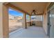 Covered patio with built-in outdoor kitchen area, perfect for entertaining guests at 43524 W Bailey Dr, Maricopa, AZ 85138