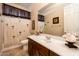 Bathroom with a shower and tub combination with palm tree shower curtain and decorative seashell accents at 4488 N 155Th Ave, Goodyear, AZ 85395