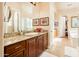 Bathroom with granite countertops, sink with wood cabinets, and tile flooring at 4488 N 155Th Ave, Goodyear, AZ 85395