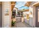 Charming courtyard featuring a cozy seating area with potted plants and an inviting entrance at 4488 N 155Th Ave, Goodyear, AZ 85395