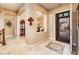 Elegant home foyer with decorative arches, tile flooring, and stylish entryway at 4488 N 155Th Ave, Goodyear, AZ 85395