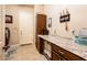 Well-organized laundry room with plenty of counter space, storage cabinets, and tiled floor, making laundry a breeze at 4488 N 155Th Ave, Goodyear, AZ 85395