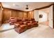 A home theater with several leather reclining chairs, a projector, carpeted floor, and paneling for an inviting space at 4488 N 155Th Ave, Goodyear, AZ 85395