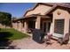 This backyard features a covered patio, lush green grass and a well-designed backyard at 455 W Gary Ave, Gilbert, AZ 85233