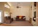 Inviting living room with a cozy fireplace, plush seating, neutral colors, and abundant natural light at 455 W Gary Ave, Gilbert, AZ 85233