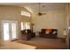 Bright living room with vaulted ceilings, fan, and plush seating area at 455 W Gary Ave, Gilbert, AZ 85233