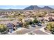 Aerial view of the home highlighting its location, desert community, and mountain views at 5137 W Quail Track Dr, Phoenix, AZ 85083