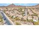 Aerial view of a property with a pool, desert landscaping, and nearby mountain views at 5137 W Quail Track Dr, Phoenix, AZ 85083