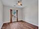 Cozy bedroom with hardwood floors and a window offering natural light at 5137 W Quail Track Dr, Phoenix, AZ 85083