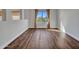 Bedroom with hardwood flooring, large windows, and natural light at 5137 W Quail Track Dr, Phoenix, AZ 85083