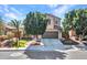 The home features a well-maintained front yard, a desert landscape, and a two-car garage at 5137 W Quail Track Dr, Phoenix, AZ 85083