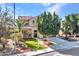 Two-story home with well-manicured landscaping, a palm tree, and desert accents at 5137 W Quail Track Dr, Phoenix, AZ 85083