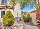 Home exterior with brick pathway, manicured landscaping, lush greenery, and cooling units at 5137 W Quail Track Dr, Phoenix, AZ 85083