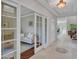 Bright hallway showcasing decorative tile flooring, modern lighting, and an open doorway to a living room at 5137 W Quail Track Dr, Phoenix, AZ 85083