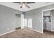 Spacious bedroom with neutral carpet, ceiling fan, and closet, perfect for relaxation at 514 W Desert Ln, Phoenix, AZ 85041